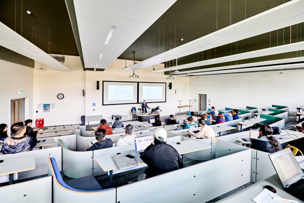 An academic teachers to lecture theatre full of students